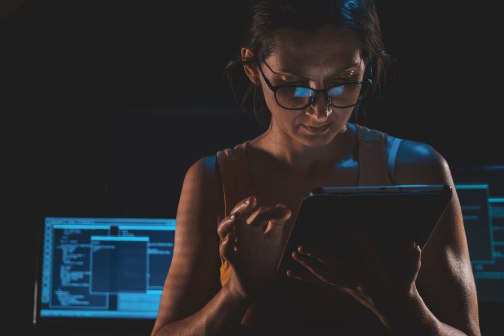 Woman Looking At Tablet Intently